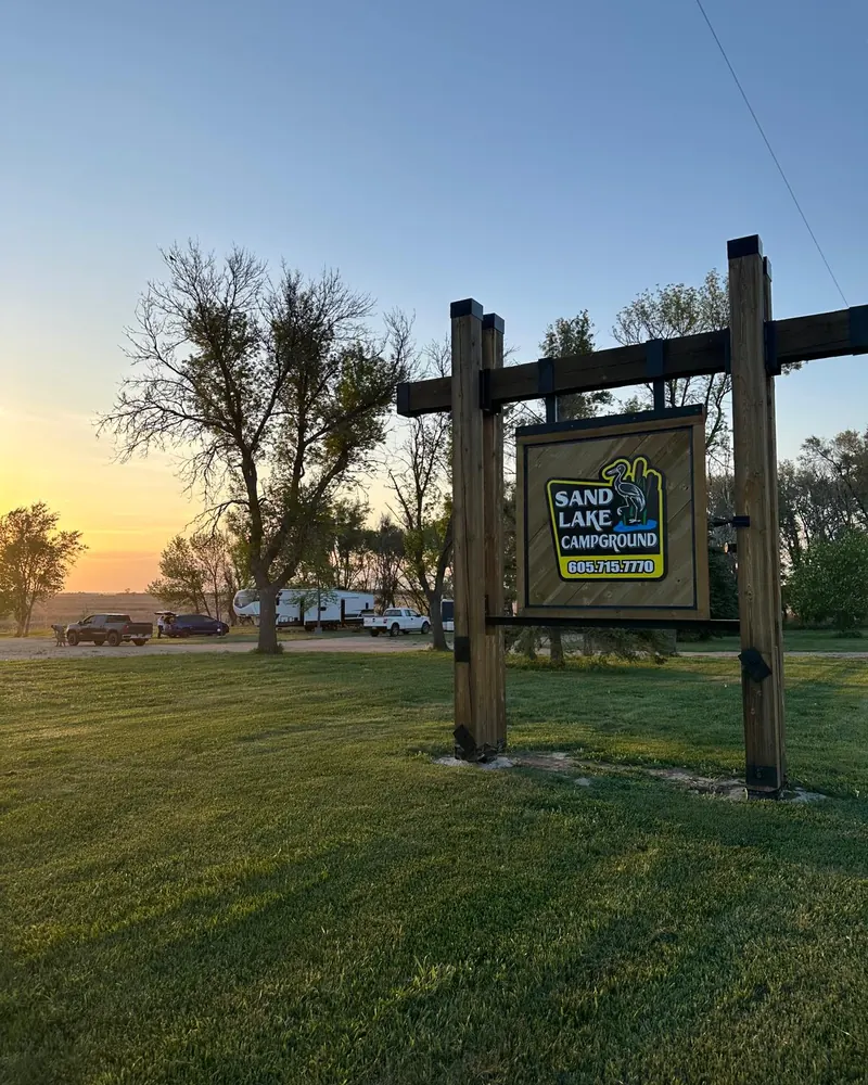 The Sand Lake Campground sign with its heron logo